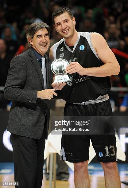 Marko Banic of Bizkaia Bilbao Basket is presented an award by President of Euroleague Jordi Bertomeu during the Best Season Players Award Ceremony at...