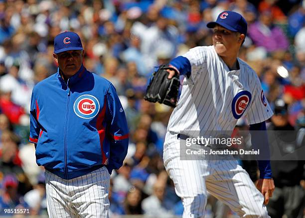 Manager Lou Piniella of the Chicago Cubs watches as starting pitcher Tom Gorzelanny throws after being hit by a ball from Pedro Feliz of the Houston...