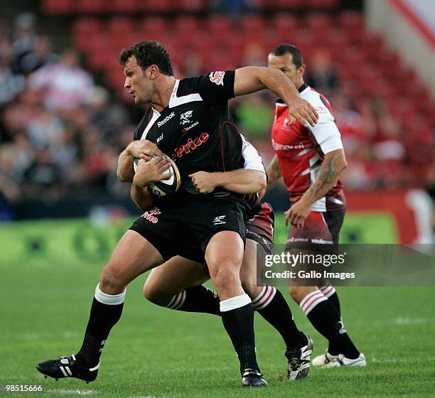 Bismarck du Plessis of the Sharks is tackled during the Super 14 match between Lions and Sharks from Coca Cola Park Stadium on April 17, 2010 in...