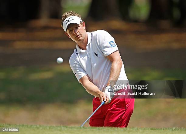 Luke Donald of England hits a pitch shot on the seventh hole during the third round of the Verizon Heritage at the Harbour Town Golf Links on April...