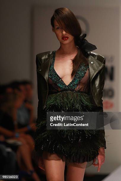 Model displays a design of Ricardo Seco during the Mercedes-Benz Fashion Week 2010 at Campo Marte on April 16, 2010 in Mexico City, Mexico.