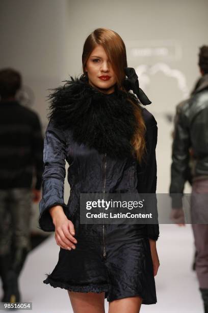 Model displays a design of Ricardo Seco during the Mercedes-Benz Fashion Week 2010 at Campo Marte on April 16, 2010 in Mexico City, Mexico.