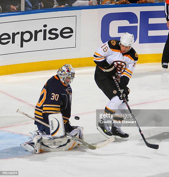 Ryan Miller of the Buffalo Sabres makes a save as Marco Sturm of the Boston Bruins watches in Game Two of the Eastern Conference Quarterfinals during...