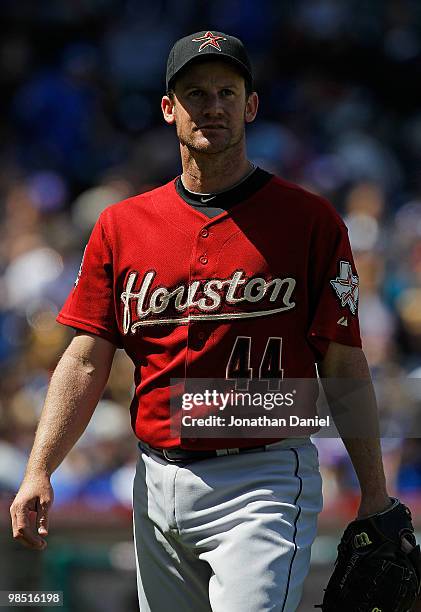 Starting pitcher Roy Oswalt of the Houston Astros walks off the field after pitching an inning against the Chicago Cubs at Wrigley Field on April 17,...