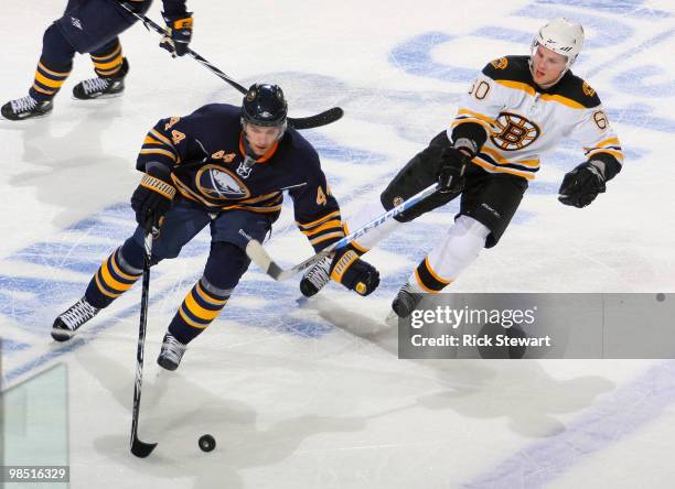 Andrej Sekera of the Buffalo Sabres skates around Vladimir Sobotka of the Boston Bruins in Game Two of the Eastern Conference Quarterfinals during...