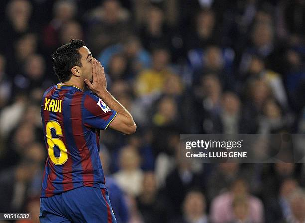 Barcelona's midfielder Xavi Hernandez reacts during a Spanish League football match against Espanyol on April 17, 2010 at the Cornella-El Prat...