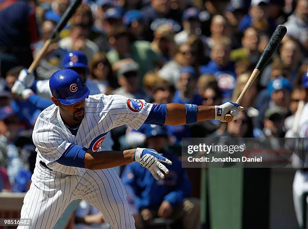Derrek Lee of the Chicago Cubs takes a swing at a pitch by Roy Oswalt of the Houston Astros to strike out at Wrigley Field on April 17, 2010 in...