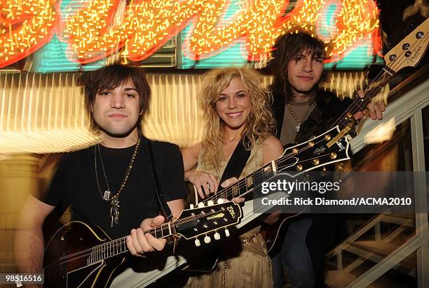 Musicians Neil Perry, Kimberly Perry and Reid Perry of The Band Perry pose at the 45th Annual Academy of Country Music Awards concerts at the Fremont...