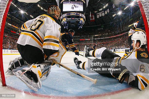 Dennis Wideman and Tuukka Rask of the Boston Bruins defend the net against Tim Connolly of the Buffalo Sabres in Game Two of the Eastern Conference...