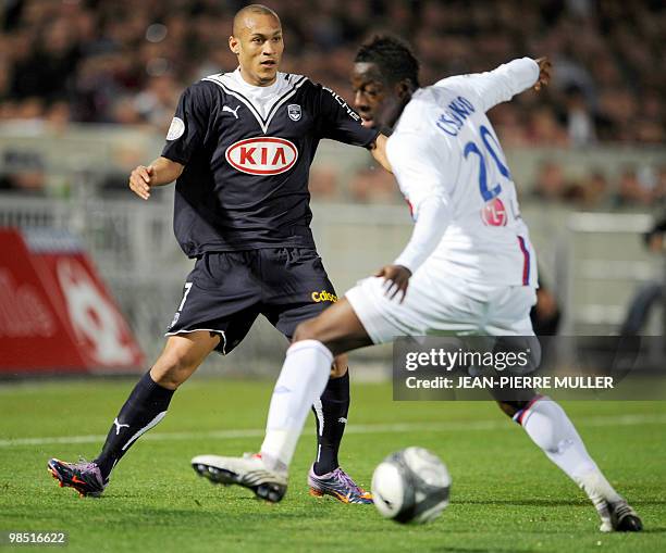 Girondin's Yoan Gouffran vies the ball Lyon's Aly Cissokho during the French L1 football match Bordeaux vs. Lyon, on April 17, 2010 at the...
