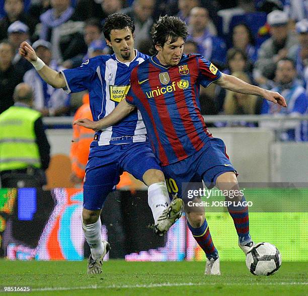 Barcelona's Argentinian forward Lionel Messi fights for the ball with Espanyol's Argentinian defender Nicolas Pareja during a Spanish League football...