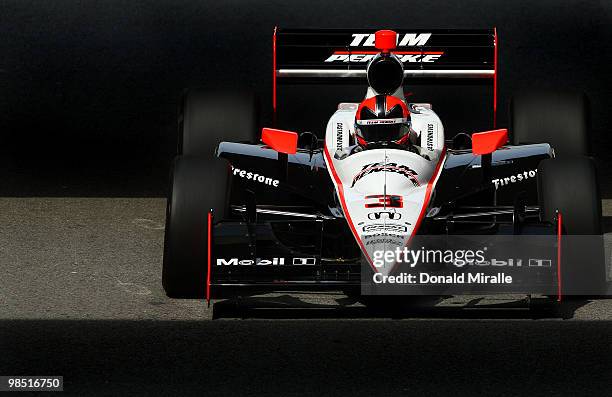 Helio Castroneves of Brazil, driver of the Team Penske Dallara Honda, drives during practice for the IndyCar Series Toyota Grand Prix of Long Beach...