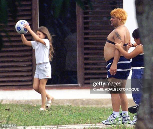 Yanina Maradona , adjusts a heart monitor on her father Diego who is undergoing drug abuse treatment in Havana 26 January 2000. Yanina Maradona , le...