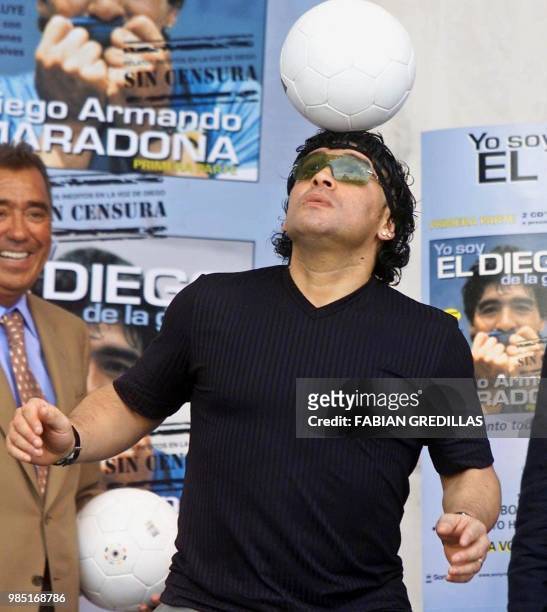 The ex-soccer player Diego Maradona plays with a ball during the presentation of two compact discs titled "I am Diego without censorships" which...