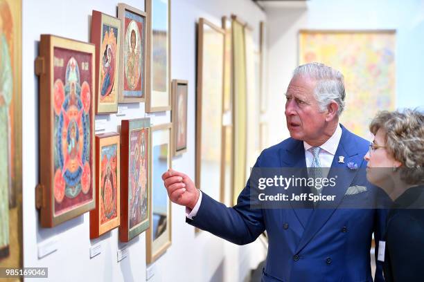 Prince Charles, Prince of Wales looks at art as he attends The Prince's Foundation School of Traditional Arts degree show in Shoreditch on June 27,...