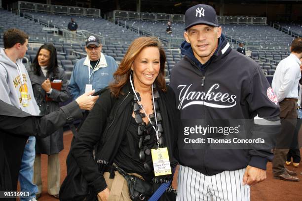 Donna Karan and Yankee Manager Joe Girardi pose for a photo before New York Yankees play against the Texas Rangers at Yankee Stadium on April 16,...