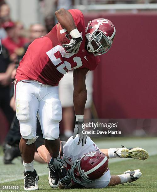 Heisman Trophy running back Mark Ingram of the Alabama Crimson Tide escapes the tackle of defensive back Will Lowery during the Alabama spring game...