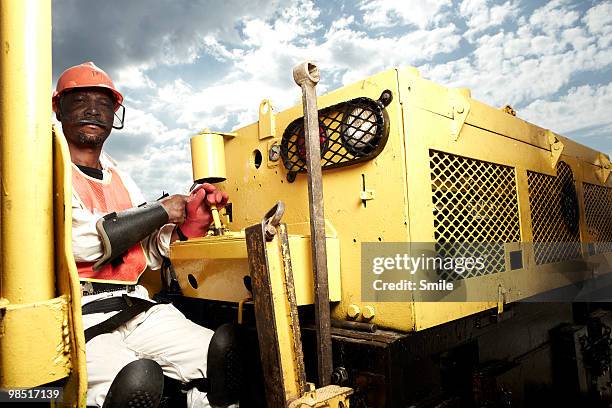 miner driving a mining locomotive - drive smile ストックフォトと画像