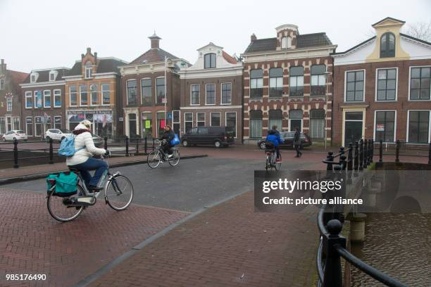 Cyclists crossing the canal bridge in the Dutch city Sneek in the Netherlands, 26 January 2018. The nearby city Leeuwarden in the Frisian province is...