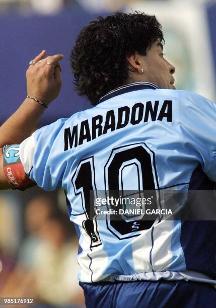 Diego Maradona is seen jumping for the ball in Buenos Aires, Argentina 10 November 2001. Diego Maradona salta buscando la pelota, integrando por...