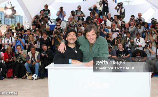 Former Argentinian football player Diego Maradona and Serbian director Emir Kusturica pose during a photocall for their film 'Maradona by Kusturica'...
