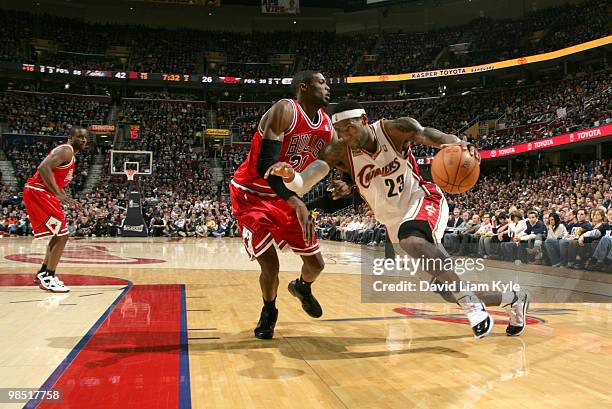 LeBron James of the Cleveland Cavaliers drives to the basket against Hakim Warrick of the Chicago Bulls in Game One of the Eastern Conference...