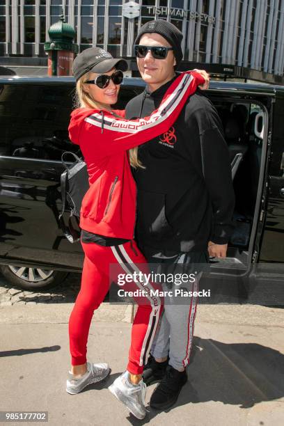 Chris Zylka and Paris Hilton are seen leaving the Fouquet's hotel Barriere on June 27, 2018 in Paris, France.