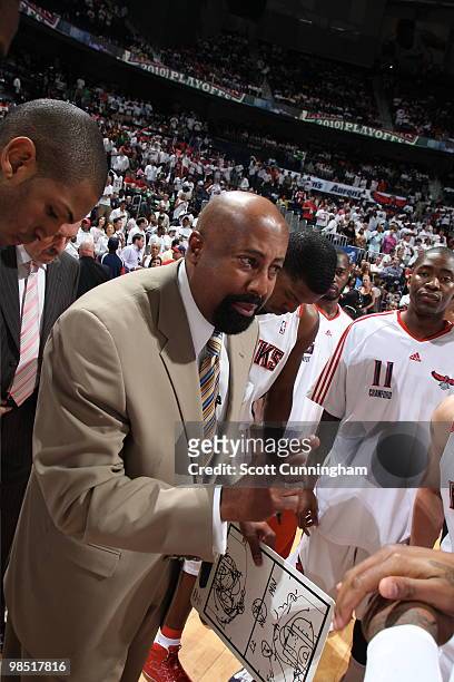 Head coach Mike Woodson of the Atlanta Hawks talks to his players before the game against the Milwaukee Bucks in Game One of the Eastern Conference...