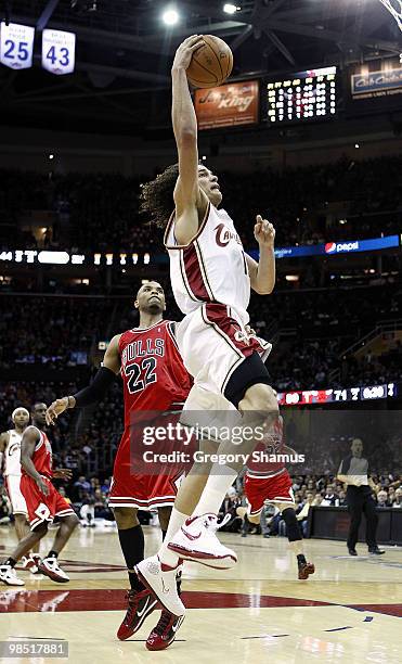 Anderson Varejao of the Cleveland Cavaliers gets to the basket in front of Taj Gibson of the Chicago Bulls in Game One of the Eastern Conference...