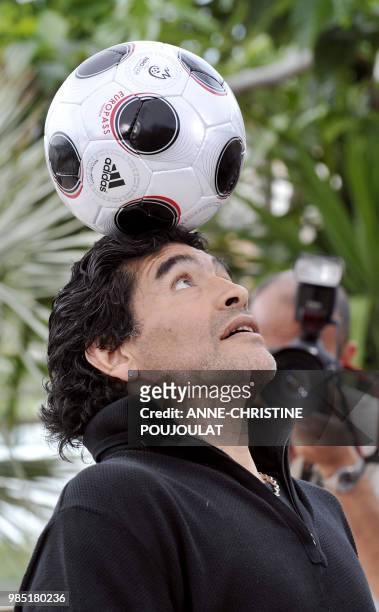 Former Argentinian football player Diego Maradona controls the ball during a photocall for Serbian director Emir Kusturica's film 'Maradona by...