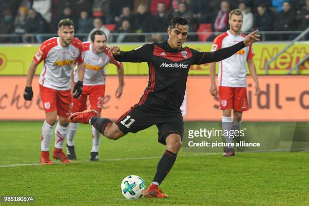 Ingolstadt's Darío Lezcano scores the 0-2 goal during a penalty shoot at the German 2nd division Bundesliga soccer match between Jahn Regensburg and...