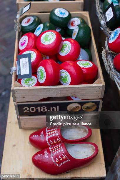 Dutch cheese and wooden shoes are displayed in front of a cheese shop in the Dutch city Leeuwarden in the Netherlands, 26 January 2018. Leeuwarden in...