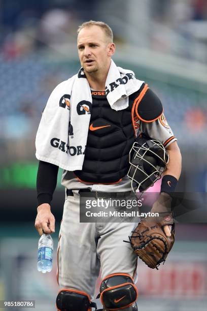 Caleb Joseph of the Baltimore Orioles walks to the dug out before a baseball game against the Washington Nationals at Nationals Park on June 20, 2018...