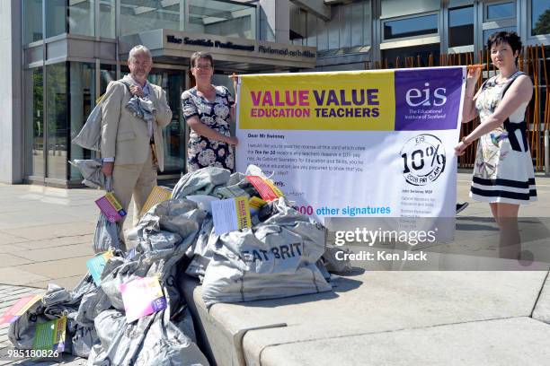 ALison Thornton , President of Scotland's largest teachers' union the Educational Institute of Scotland, and colleagues prepare to hand in a 25,000...