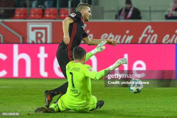 Regensburg's goalkeeper Philipp Pentke fouls Ingolstadt's Robert Leipertz during the German 2nd division Bundesliga soccer match between Jahn...