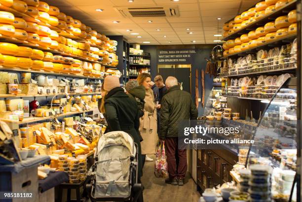 Customers standing in a cheese for Dutch cheese in Leeuwarden, Netherlands, 26 January 2018. Leeuwarden in the Frisian province is the Capital of...