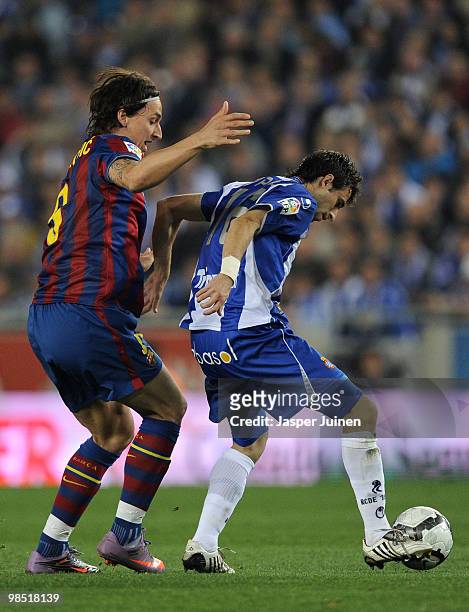 Zlatan Ibrahimovic of FC Barcelona duels for the ball with Nicolas Pareja of Espanyol during the La Liga match between Espanyol and Barcelona at the...