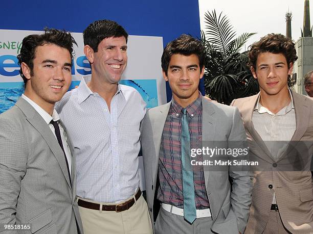 Musician Kevin Jonas, Chairman of The Walt Disney Studios Rich Ross, and musicians Joe Jonas and Nick Jonas arrive at the premiere of Walt Disney...