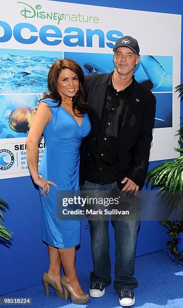 Meteorologist Alysha Del Valle and artist Robert Wyland arrive at the premiere of Walt Disney Pictures' 'Oceans' at the El Capitan Theatre on April...