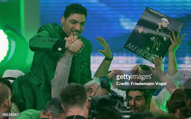 Mehrzad Marashi celebrates after winning the contest 'DSDS - Deutschland Sucht Den Superstar' final show on April 17, 2010 in Cologne, Germany.