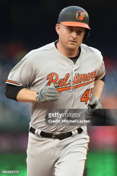 Mark Trumbo of the Baltimore Orioles runs to third base during a baseball game against the Washington Nationals at Nationals Park on June 20, 2018 in...