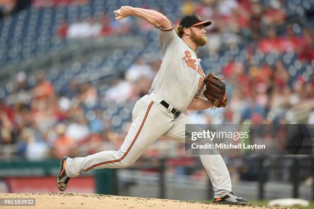 Andrew Cashner of the Baltimore Orioles pitches during a baseball game against the Washington Nationals at Nationals Park on June 20, 2018 in...