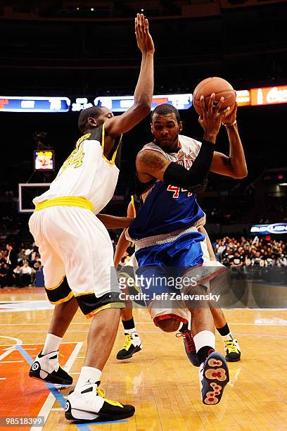 Moore of Suburban Team drives against Ryan Rhoomes of City Team during the Regional Game at the 2010 Jordan Brand classic at Madison Square Garden on...