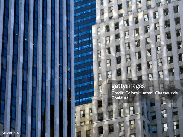 glass and stone buildings manhattan - chasseur stock-fotos und bilder