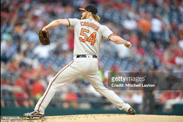 Andrew Cashner of the Baltimore Orioles pitches during a baseball game against the Washington Nationals at Nationals Park on June 20, 2018 in...