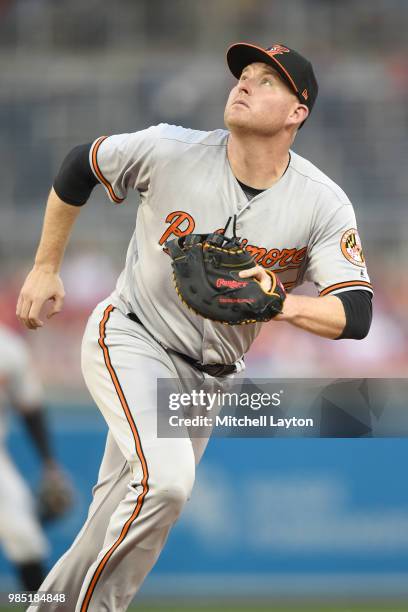 Mark Trumbo of the Baltimore Orioles in position to field a pop up during a baseball game against the Washington Nationals at Nationals Park on June...