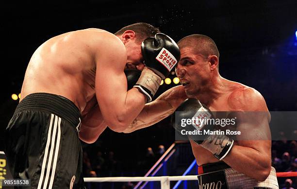 Sebastian Zbik of Germany exchanges punches with Domenico Spada of Italy during the WBC middleweight interim world championship fight during the...