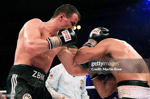 Sebastian Zbik of Germany exchanges punches with Domenico Spada of Italy during the WBC middleweight interim world championship fight during the...