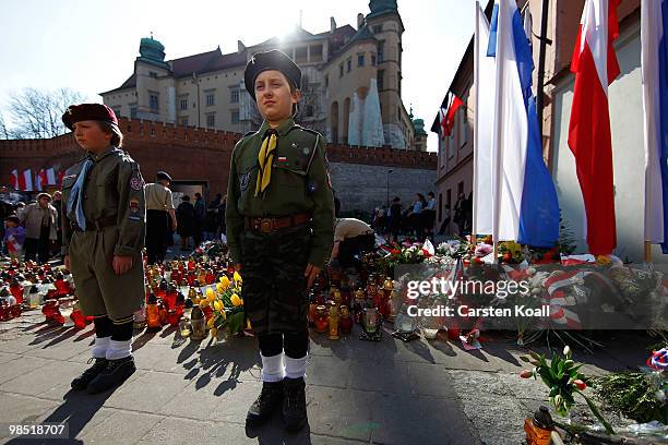 Members of the Polish Scouts youth organization stand guard in honor of the late polish President Lech Kaczynski and his wife Maria near the castle...