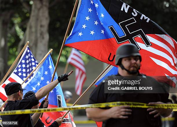 Members of the neo-nazi group, The American National Socialist Movement, protest during a rally in front of the Los Angeles City Hall, on April 17,...